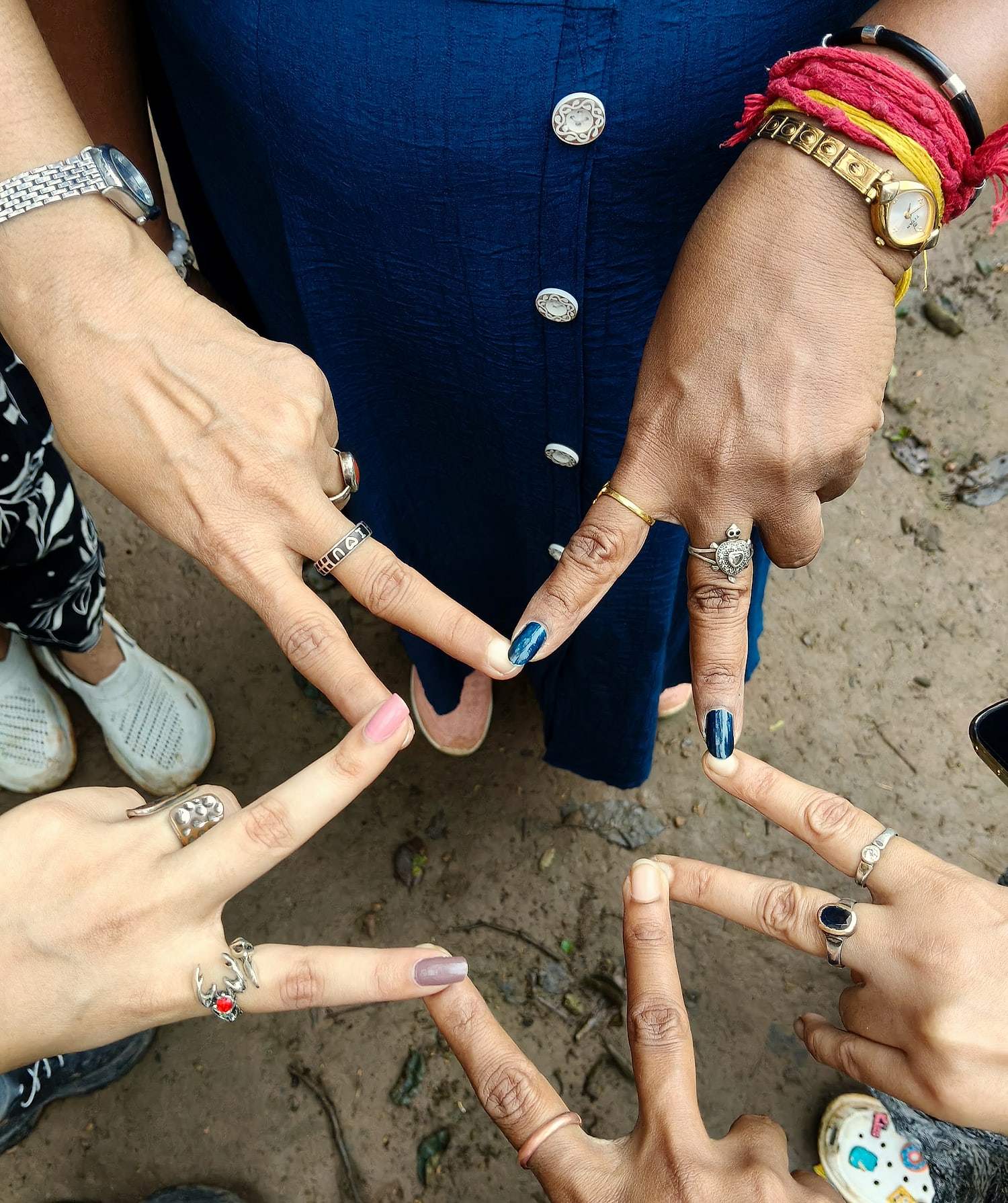 ECHEPURON travellers joining hands in a star on a trip to Mainpat