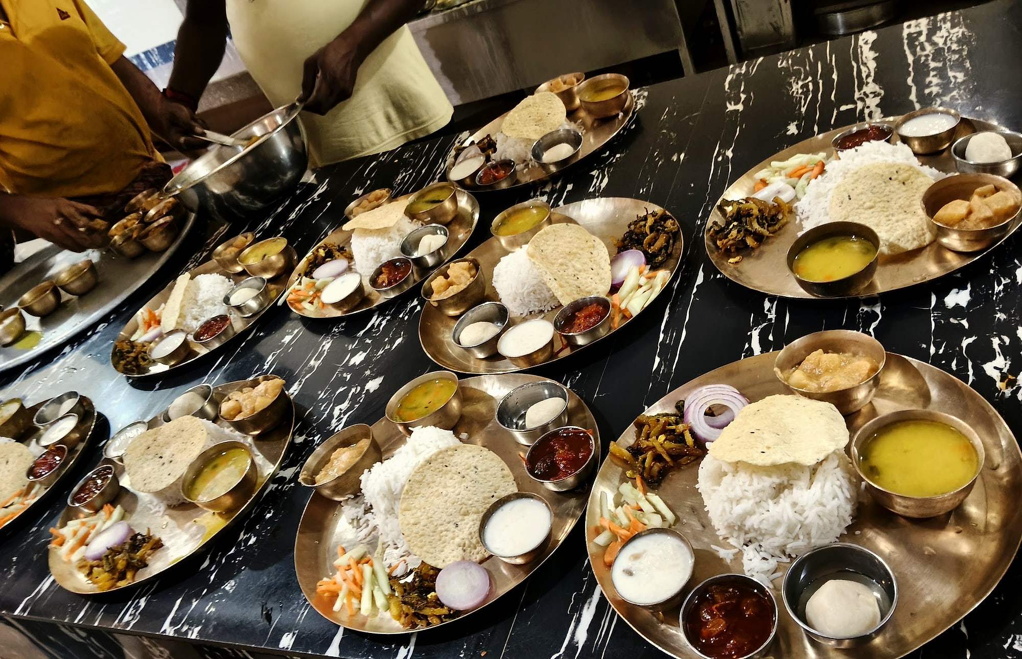 A table laid with traditional thalis for a group lunch